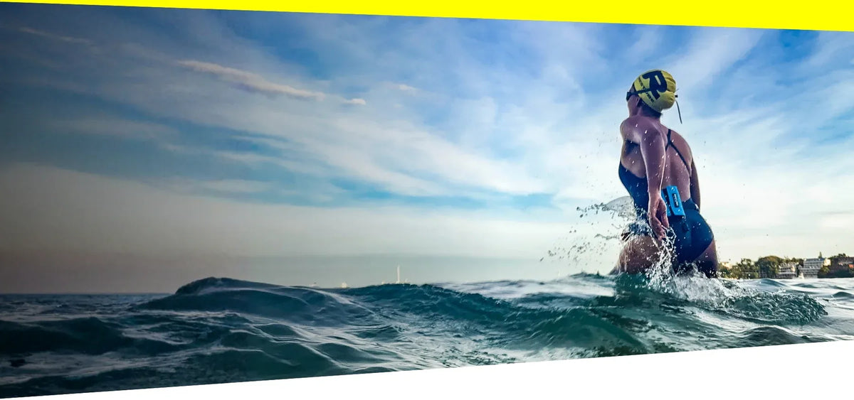 Triathlete swimmer with RESTUBE safety buoy - Triathlon water safety Philippines