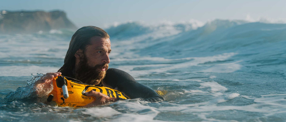 Surfer with inflated RESTUBE Safety Buoy