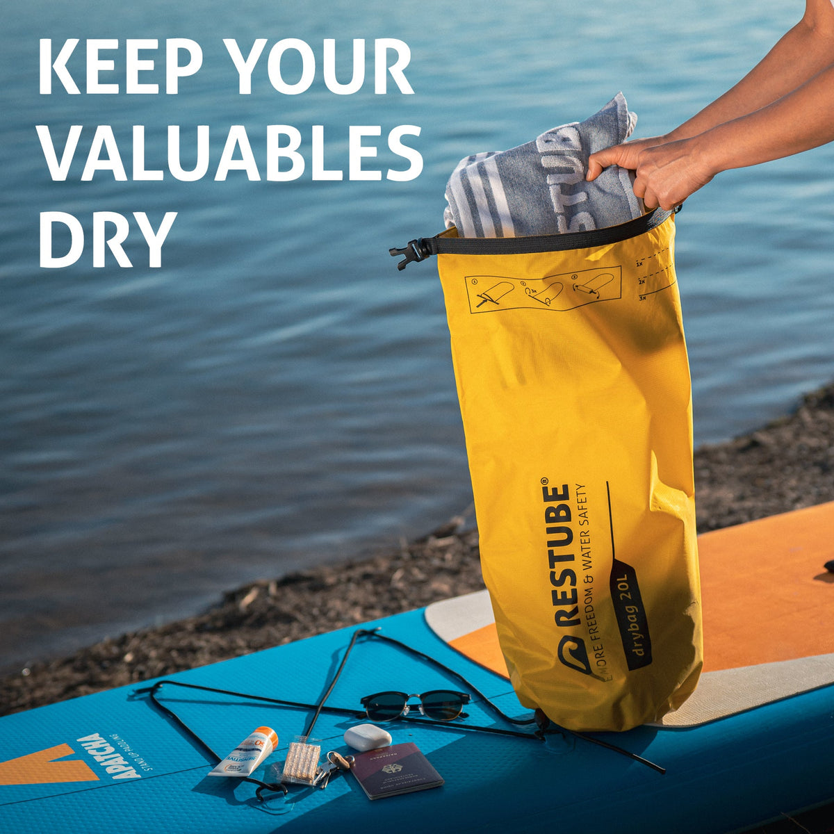 RESTUBE DRYBAG lifestyle shot - being used at beach or lake for water sports Philippines